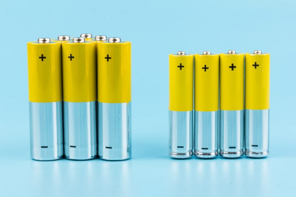Rechargeable Batteries are photographed against a blue background.