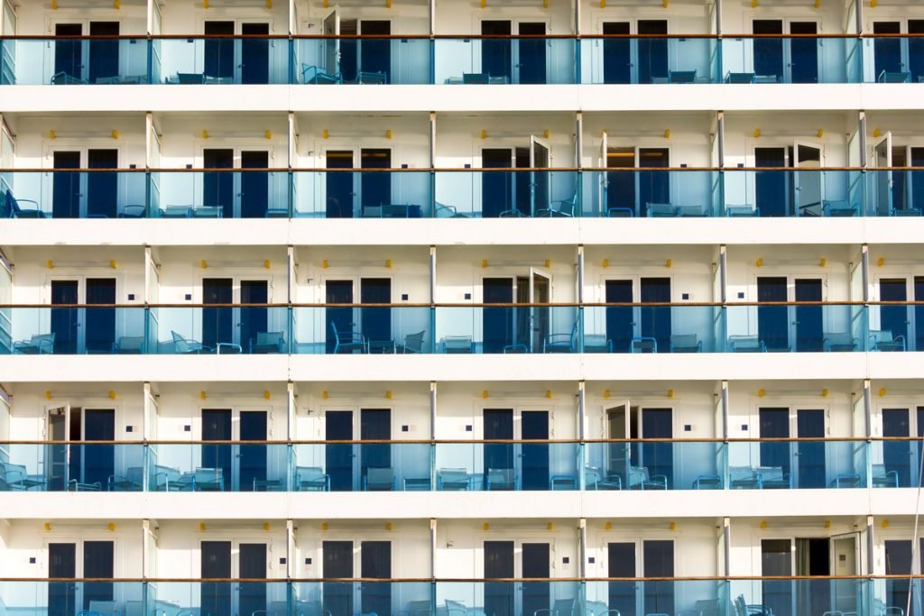 The balconies on cabins on a cruise ship are shown.