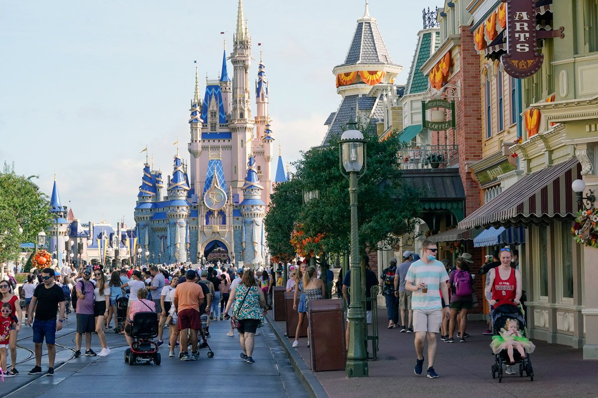 Guests stroll along Main Street at the Magic Kingdom theme park at Walt Disney World.