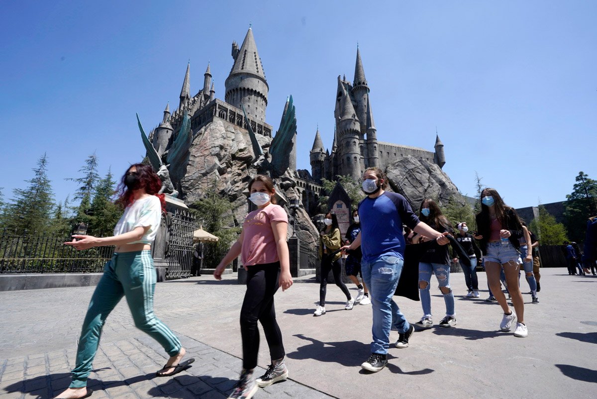 People walk around Wizarding World of Harry Potter. 