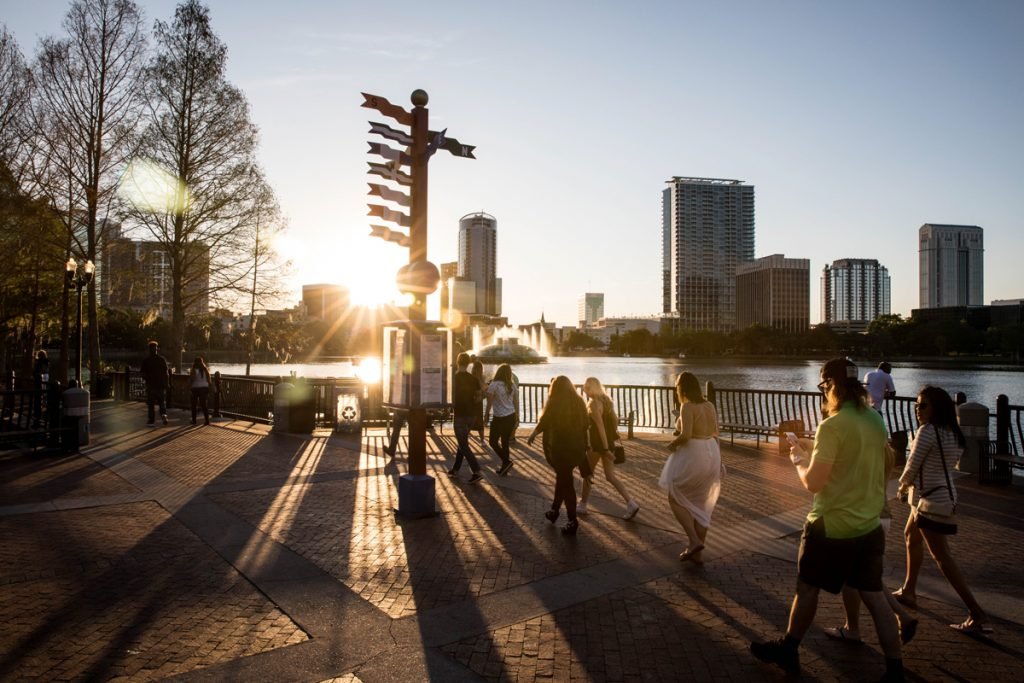 A group of people walk in the park.