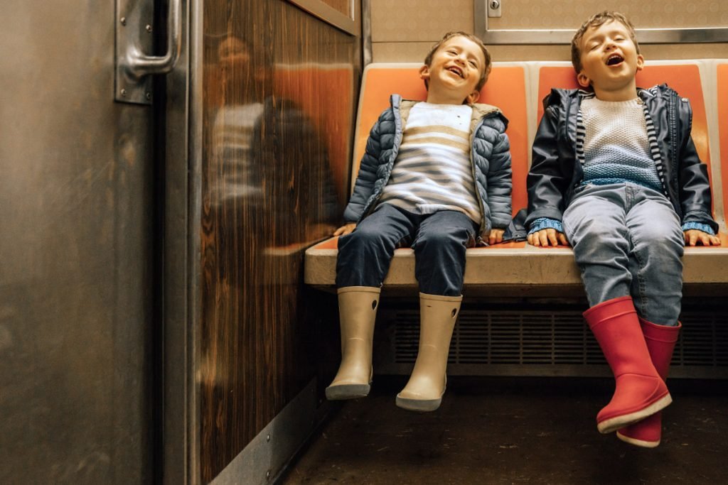 Two boys ride the subway in New York City.
